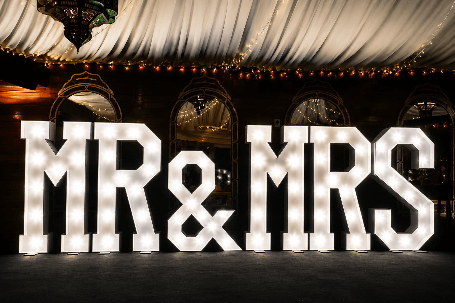 Illuminated LED Mr and Mrs sign at a wedding reception